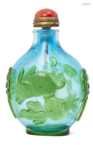 A Chinese Peking glass cameo snuff bottle, late Qing dynasty, carved in green over blue with a