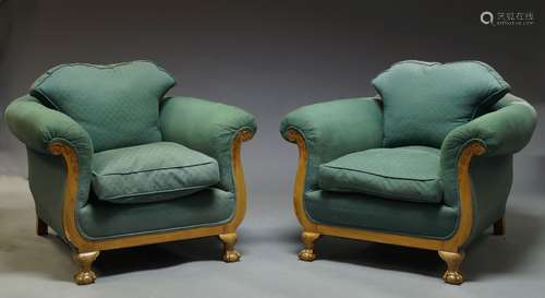 A pair of walnut framed armchairs, early 20th Century, with scrolling acanthus carved arms,