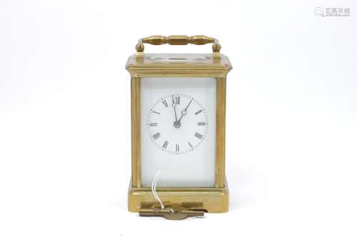 A brass carriage clock by Joseph Soldano, the white enamel dial with roman numeral chapter ring, the