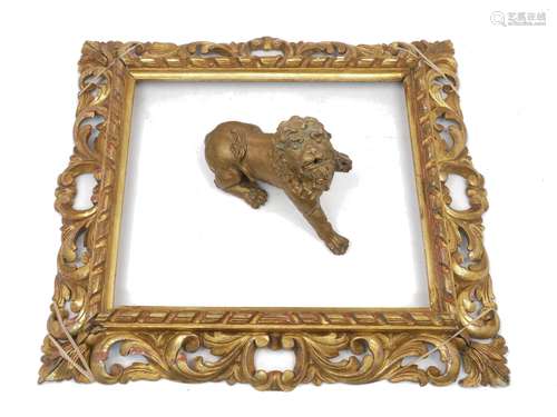 A carved giltwood rectangular frame, 19th century, 48cm x 53cm and an 18th century carved wood lion,