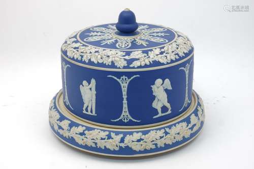 An English blue jasperware cheese bell and base, 19th century, decorated with a frieze of amorini in