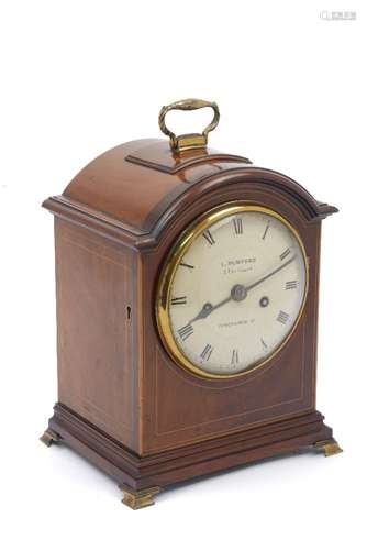 A Victorian mahogany and line inlaid mantel clock by L. Mumford, with brass carrying handle to the