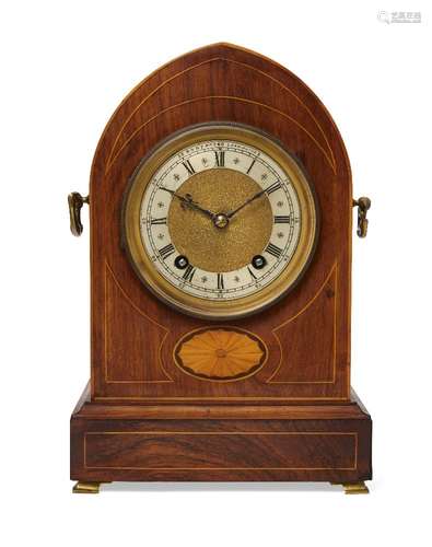 An Edwardian rosewood and line inlaid lancet shaped mantel clock by Robert Leamington, with bats