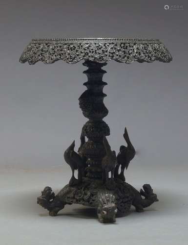 An Anglo Indian hardwood side table, early 20th Century, the circular top with carved and pierced