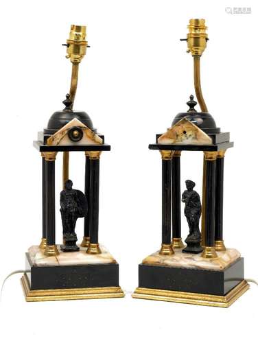 A pair of late Victorian clock garnishes in the form of Neoclassical temples, of gilt metal with