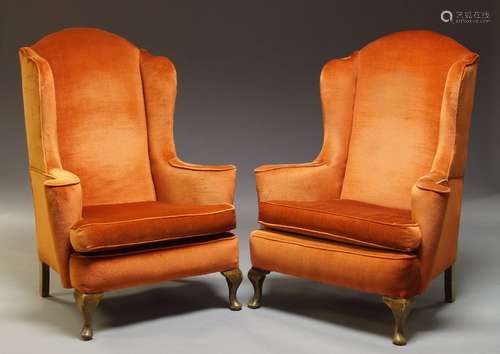 A pair of Queen Anne style wing back armchairs, mid-20th century, on squat cabriole front legs, a