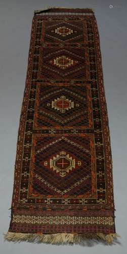 A Turkmen runner, of four panel design, 288cm x 65cm, with another, having three medallions, 282cm x