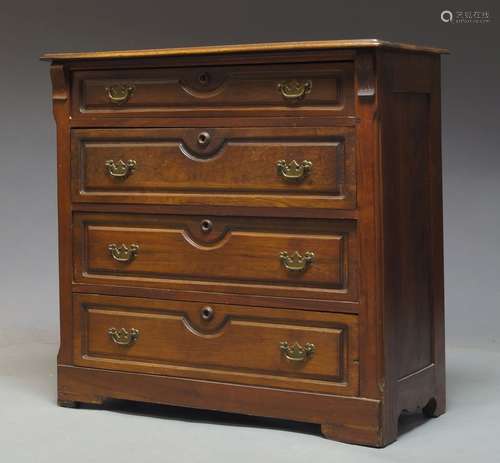 A Continental chest of drawers, late 19th,early 20th Century, with four long graduated drawers,