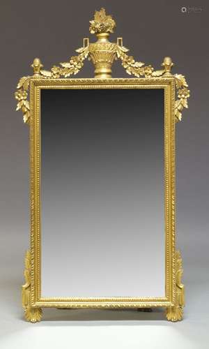 A Louis XVI style giltwood wall mirror, 20th Century, the pierced acanthus leaf and foliate cresting