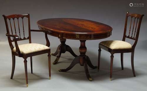 A reproduction mahogany dining suite, second half 20th Century, comprising a twin pedestal dining