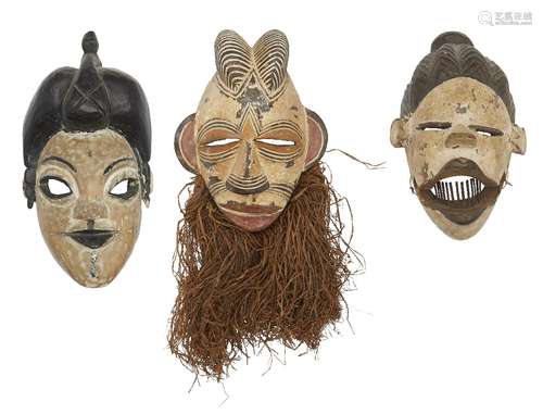 A Tribal pottery mask, 20th century, with stylised headdress and grass adornment, overall