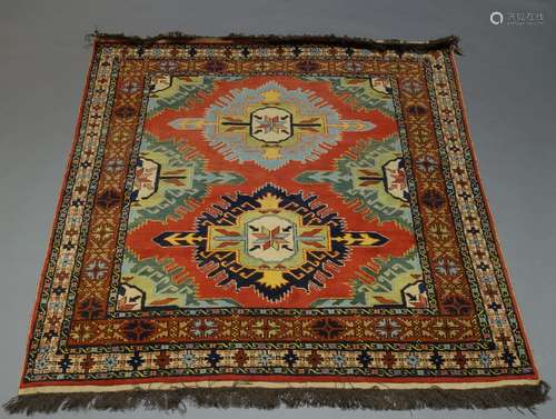 A Turkish rug, with two medallions in red field, 183cm x 158cm, together with a Kazak rug with three