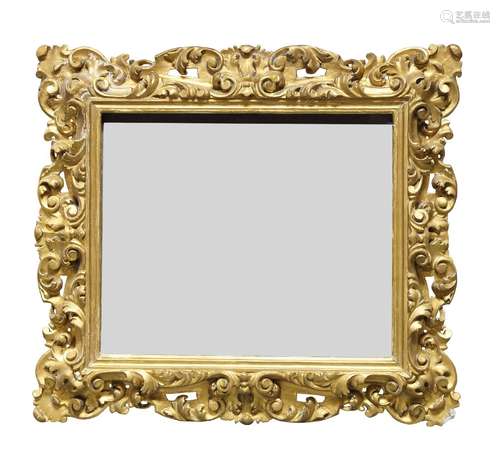 A Continental carved giltwood mirror, 19th century and later, of rectangular form, the pierced frame