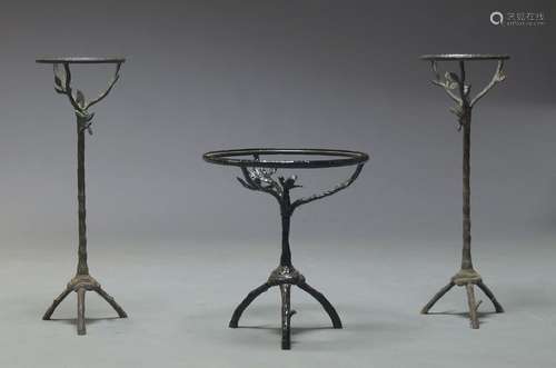 A black painted cast metal side table, lacking top, the tripod base of tree form, 45cm high, 41cm