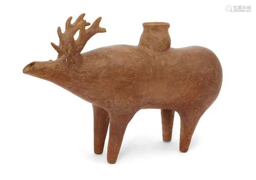 A reproduction Amlash rhyton in the form of a stag, 28cm high, 40cm long Provenance: Property of a