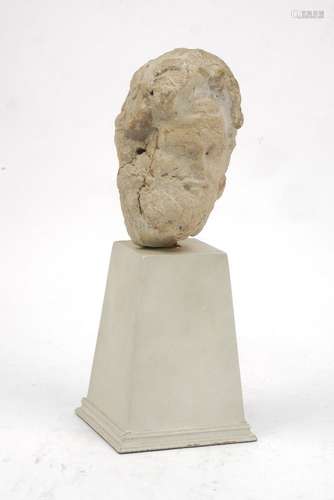 A Grand Tour Roman style carved stone head, mounted on later plinth, 28.5cm high150