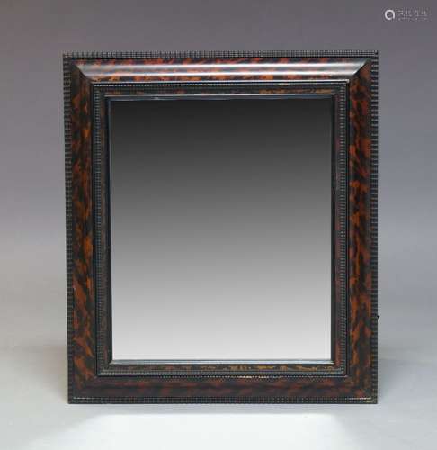 A Dutch style faux tortoise shell and ebonised wall mirror, early 20th Century, of rectangular form,