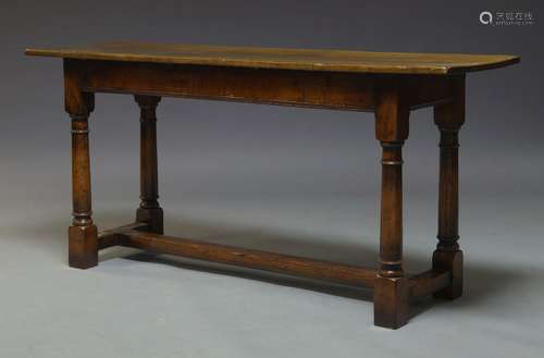 A small oak refectory table, mid 20th Century, with two plank top, on turned tapering supports