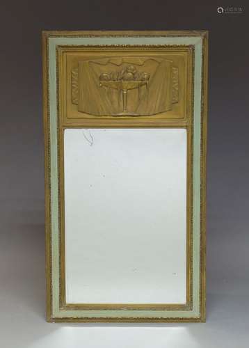 An Art Deco green painted and parcel gilt wall mirror, c.1930, of rectangular form, the frieze