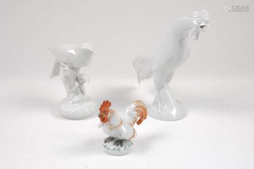 A Meissen figure of a cockerel, 20th century, decorated with red glazes, standing on a round base,