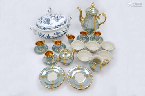 A Meissen porcelain tureen, with two handles and a lid, decorated in blue and white with the onion