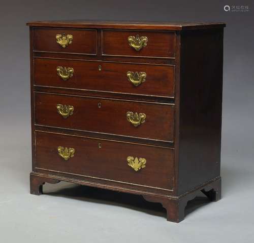 A George III mahogany chest of drawers, with later elements, with two short over three long