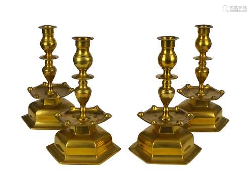 A set of four brass candlesticks, probably Flemish, 18th century, 24cm high (4)180