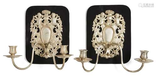 A pair of silver plated two light wall appliques, in the 17th century taste, 20th century, the