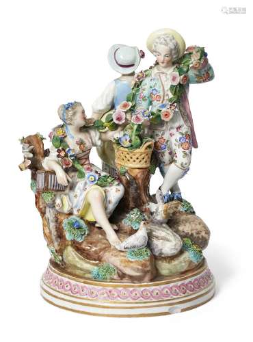 A Continental Meissen style porcelain figure group, late 19th century, set in a natural landscape, a