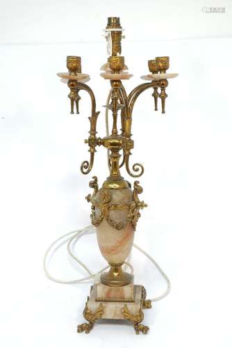 A pair of French Rococo style gilt metal candelabras, late 19th / early 20th century, 63cm high,