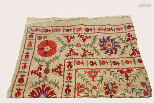 A rectangular Suzani type spread, 20th century, embroidered in chain stich with a central panel of