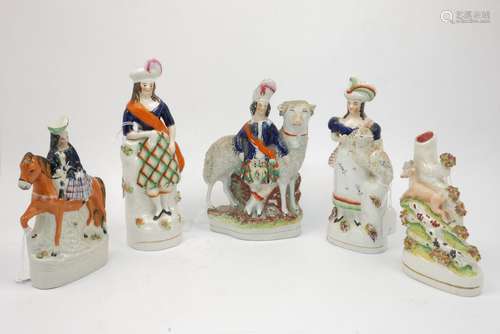 A group of five Staffordshire figures, mid/late 19th century, to comprise a highland man with a