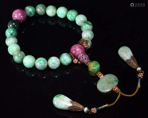 A JADEITE CARVED BRACELET WITH TOURMALINE