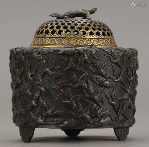 A COPPER CAST CRANE PATTERN CENSER