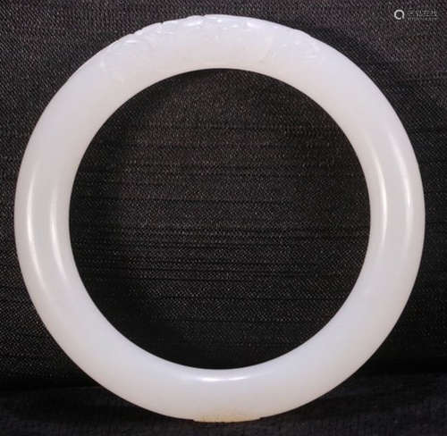 A HETIAN JADE CARVED BANGLE