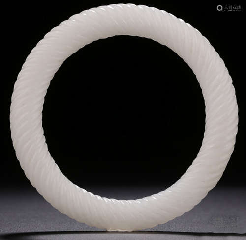 A HETIAN JADE CARVED BANGLE