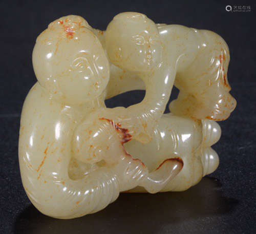 A HETIAN JADE CARVED CHILD SHAPED PENDANT