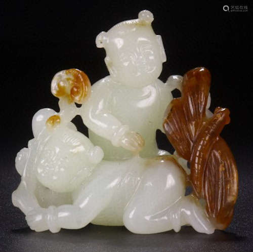 A HETIAN JADE CARVED CHILD SHAPE PENDANT