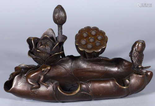 A COPPER CAST LOTUS SHAPE BRUSH WASHER