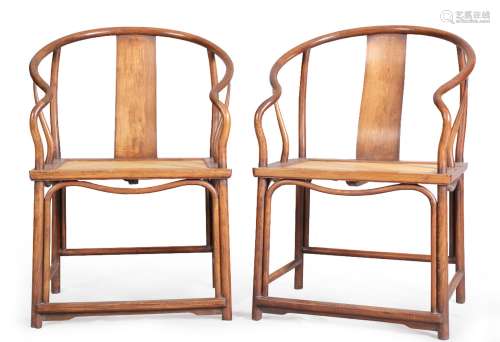 A PAIR OF HUANGHUALI HORSESHOE-BACK ARMCHAIRS