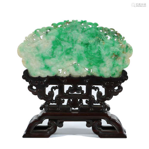 CARVED JADITE DECORATION ON RAISED WOOD STAND