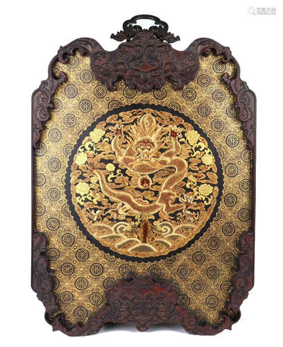 A FINEELY CARVED GILT-PAINTED ZITAN WOOD 'DRAGON' PANEL