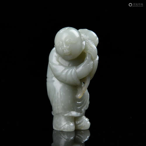 A CHINESE CARVED JADE BOY