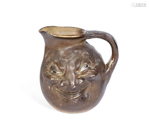 The Martin Brothers (British) A Double-Sided Stoneware Face Jug, executed 1897