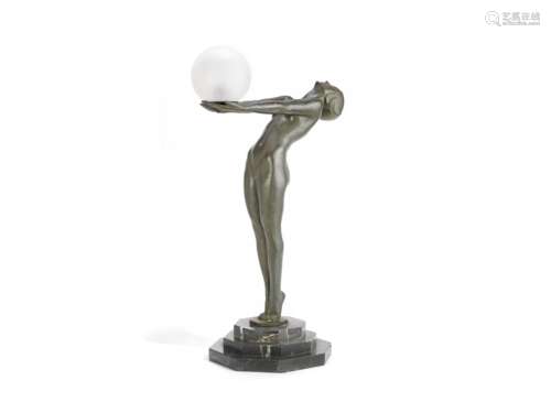 Max le Verrier (French, 1891-1973) Clarté: A Large Art Deco Green Patinated Metal Figural Lamp; m...