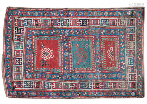 A triple medallion Kazak rug 148 x 253cm