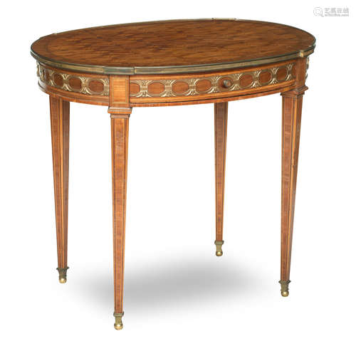 A Louis XVI style French walnut and parquetry inlaid gilt metal mounted occasional table, early 20th century