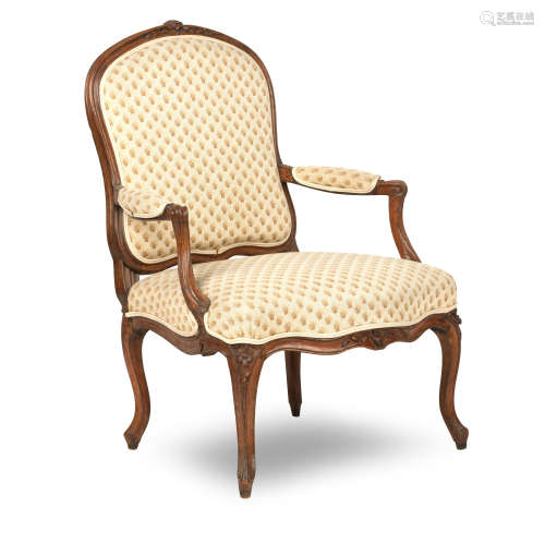 A Louis XV carved beech framed Fauteuil