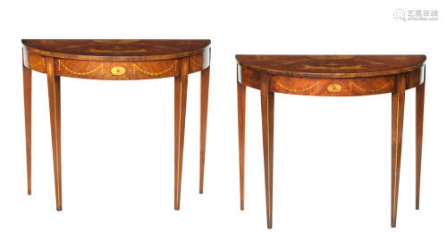 A pair of 19th century style mahogany and marquetry inlaid demi-lune tables