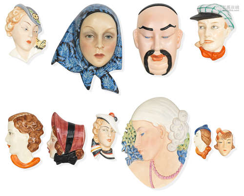 A collection of wall masks including a Lenci wall mask attributed to Elena König Scavini Circa 1930